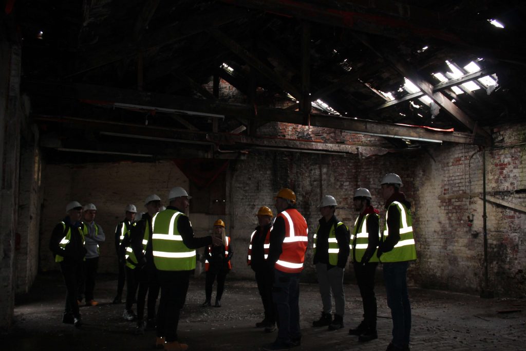 Sunderland College students inside a derelict building at 'The Stables at Sheepfolds' site, which is currently under construction.